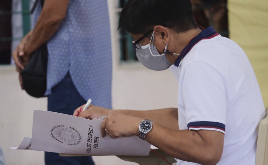 Presidential candidate Ferdinand Marcos Jr., the son of the late dictator, votes at a polling center in Batac City, Ilocos Norte, northern Philippines on Monday.