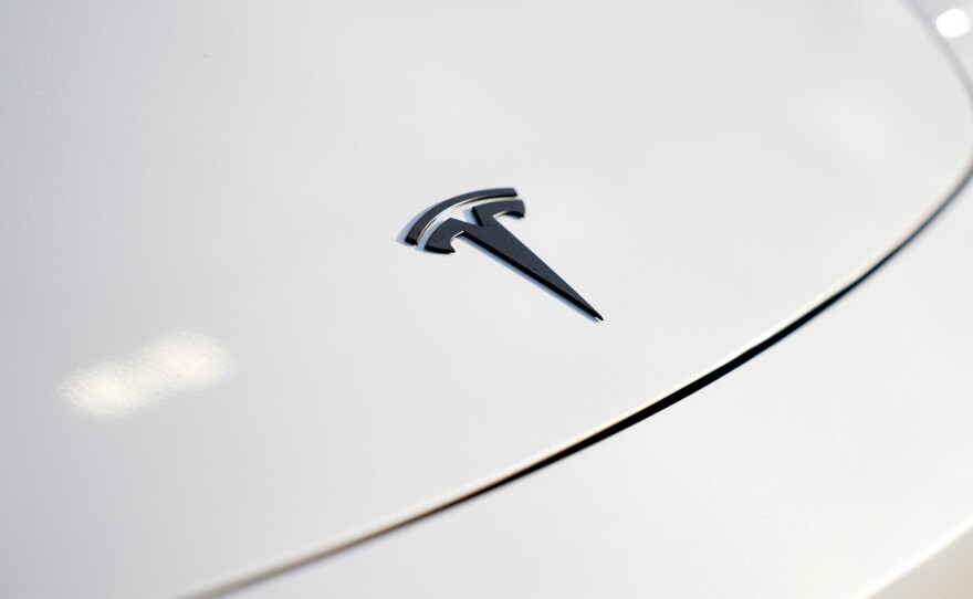 A logo for Tesla is seen on a vehicle at a Tesla facility Wednesday, April 15, 2026, in Portland, Ore.