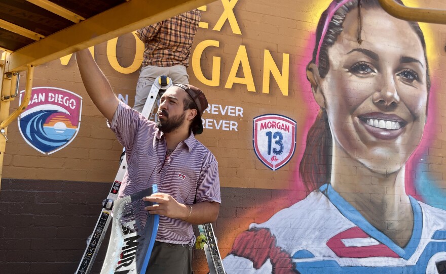 Artist Paul Jimenez preps his gear to complete the mural of soccer star Alex Morgan at Mike Hess Brewing in North Park, Sept. 5, 2025.
