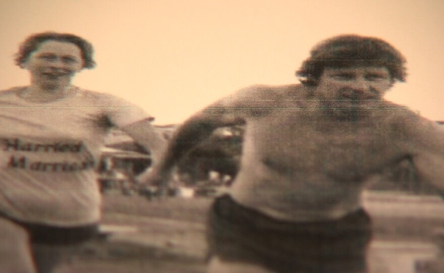 Betty and Jack Johnstone run together in a 24-hour relay race on the track at Patrick Henry High School. Their team name was the "Harried Marrieds."