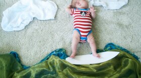Baby Mila as a "Surfer Girl" while she naps. Created and photographed by her mother, Adele Enersen. 