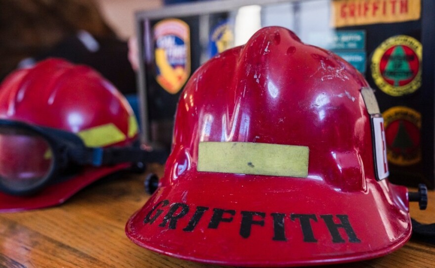 Griffith's structural helmet (left) and wildland fire helmet (right) at his home in Escondido. He retired after 30 years on the job.