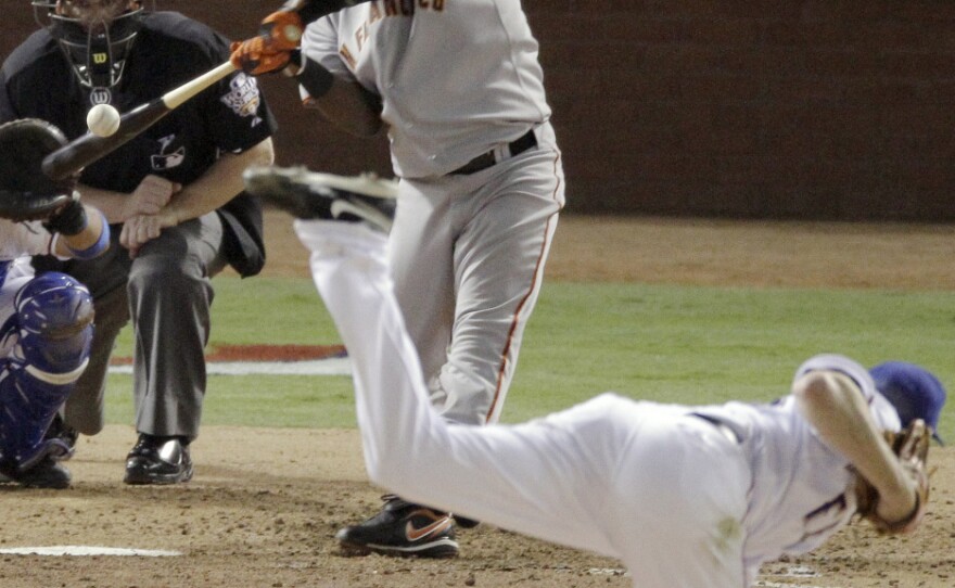 San Francisco's Edgar Renteria hits a three-run home run off Rangers pitcher Cliff Lee during the seventh inning Monday. Renteria was named series MVP.