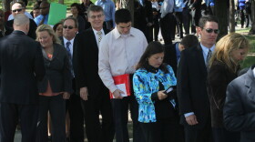 Job seekers wait in line to meet with recruiters at a job fair in Park Ridge, Ill., Sept. 15.
