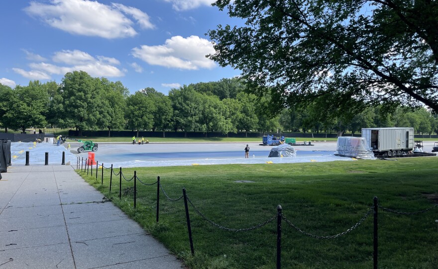 On Monday, the reflecting pool was empty — save for construction materials and vehicles — and blocked off by construction tarp.