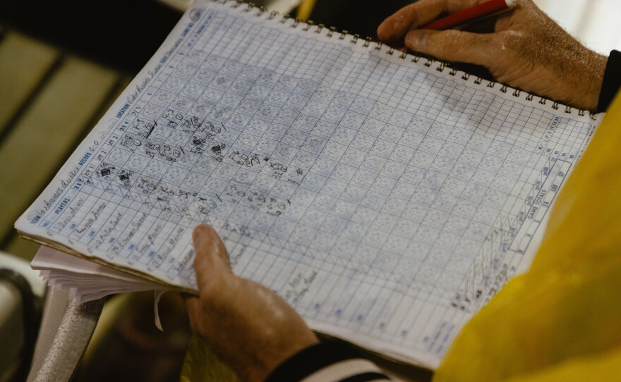 A fan's rain-soaked scorecard on the WPBL's opening day.