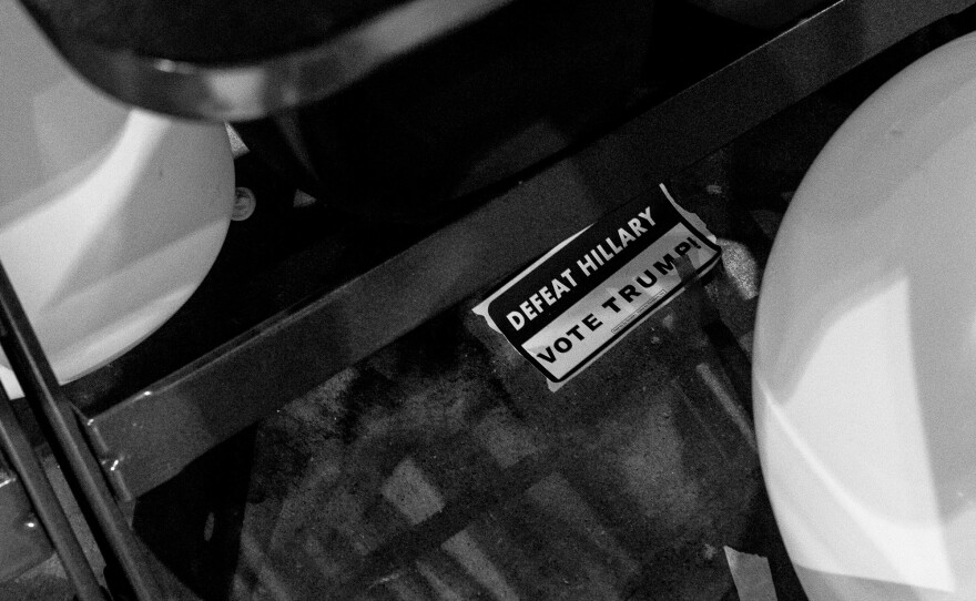 An anti-Hillary Clinton sticker lies discarded on the floor at the close of the convention.