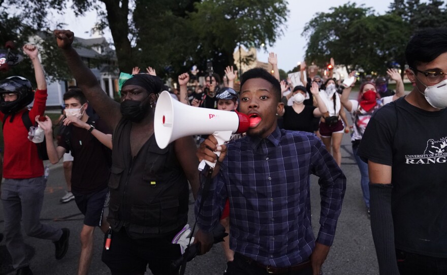 Protesters march on Wednesday against the Sunday police shooting of Jacob Blake in Kenosha, Wis., over the weekend.