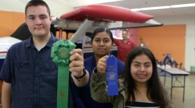 Current and former JROTC students at Vista High School display ribbons they won for the construction of a flight simulator at the San Diego County Fair,  June 29, 2018.