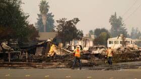 PG&E employees work in Santa Rosa after the Tubbs Fire in this undated photo. 