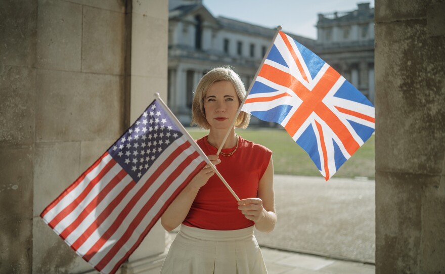 Lucy Worsley with the British Flag and American Flag at the Old Royal Naval College in Greenwich.