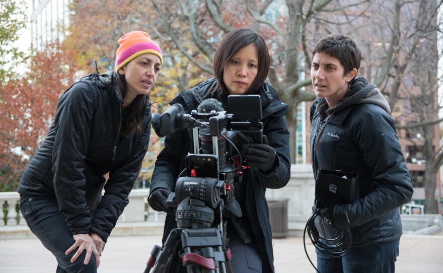 Filmmakers Laura Ricciardi (left) and Moira Demos (right) work alongside Iris Ng on the set of Making a Murderer.