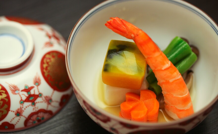 Even the dishware carries meaning. For a demonstration, executive chef Ryo Iizawa of the Embassy of Japan chose red and white dishware because "it's very Japanese" — red is symbolic of Japan, he explains, while white is a color for celebrations.