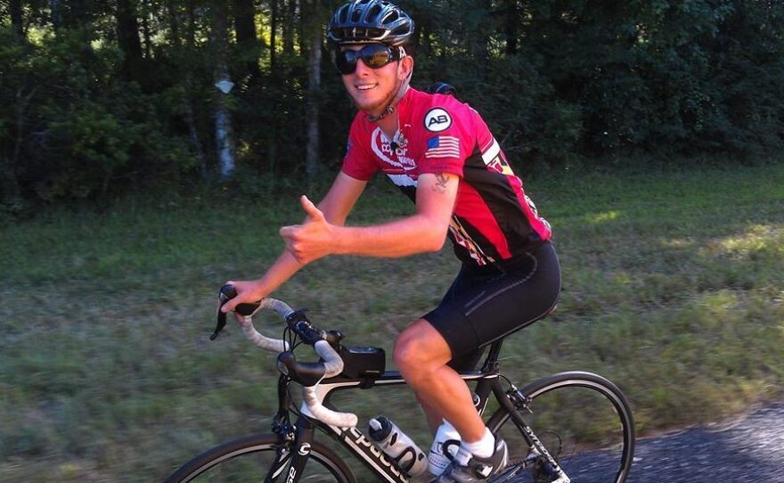 Jacob Landis has been riding his bike to every Major League Baseball stadium, to raise money to help the needy pay for cochlear implants. His ride ended Saturday night due to a crash — but Landis says he'll still be at the Marlins' stadium next week.