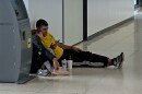 Migrants have been waiting as long as 36 hours for flights out of San Diego International Airport. This man slept on the floor near baggage claim while waiting for his flight.