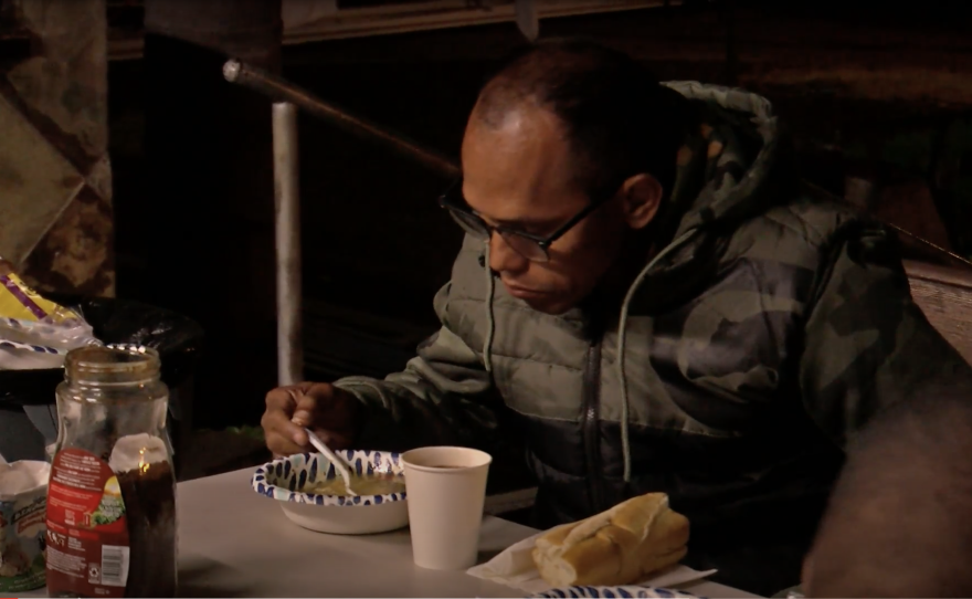 José Gregorio Castillo Quiñonez eats dinner at Our Lady of Guadalupe Church in Logan Heights on Wednesday, Nov. 15, 2023.