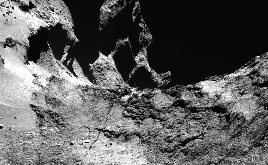 A narrow-angle camera image shows part of a large fracture running across Comet 67P/Churyumov–Gerasimenko's neck.