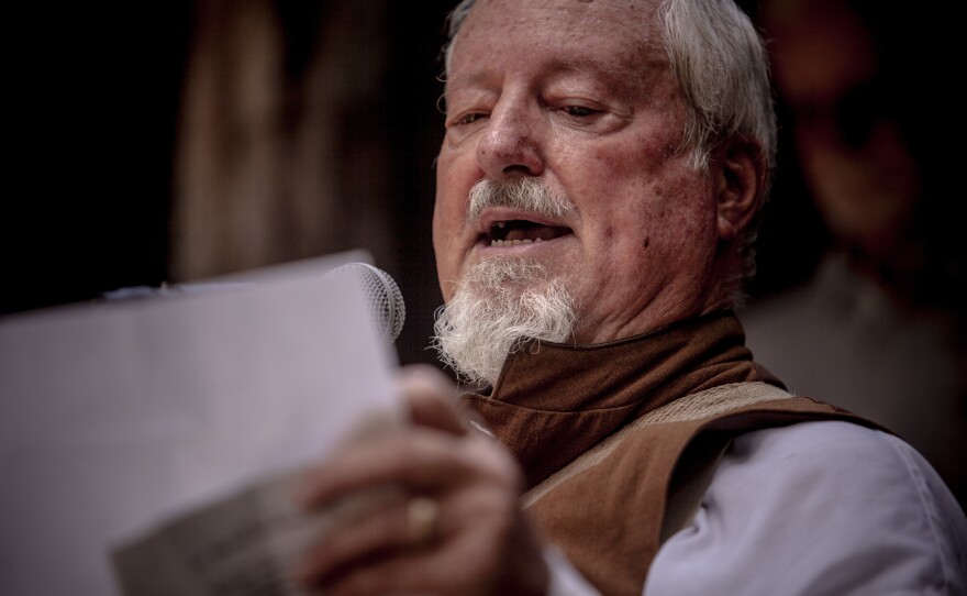 Lee Millar of the local Sons of Confederate Veterans chapter reads a proclamation declaring July 13 "Nathan Bedford Forrest Day" at a celebration honoring the Confederate general.