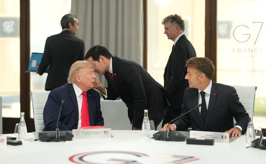 United States Secretary of State Marco Rubio, center, speaks with U.S. President Donald Trump, left, during a working session at the G7 summit in Evian-les-Bains, France, Tuesday, June 16, 2026.
