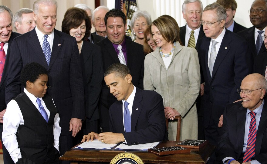 President Obama signs the Affordable Care Act on March 23, 2010. Since then, the bill has been a battering ram for Republicans. But they're struggling to replace it under President Trump.