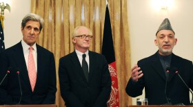 <strong>Oct. 20:</strong> Sen. John Kerry (from left), U.N. envoy Kai Eide and Afghan President Hamid Karzai discuss plans for a runoff against his main rival, Abdullah Abdullah. Karzai called the vote a "step forward" for democracy in the troubled country, but Abdullah later pulled out of the runoff before the vote was held, claiming it would be tainted.