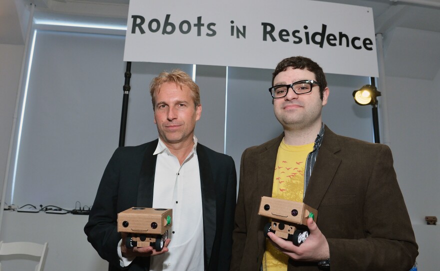 Brent Hoff (left) and Alexander Reben, creators of "Robots in Residence," hold BlabDroids at the 2013 Tribeca Film Festival in New York City. Hoff and Reben teamed up to see whether they could design a robot that would make people want to open up.