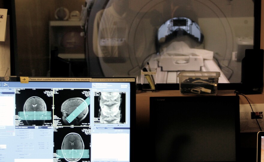 One of the study participants undergoes an MRI scan, to help researchers figure out which parts of the brain's facial recognition system change with age.