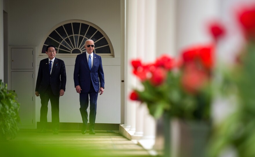 President Biden and Japanese Prime Minister Fumio Kishida walk on the colonnade as they make their way to a meeting in the Oval Office at the White House.