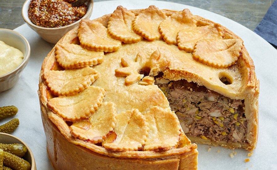 Savory game pie featuring a unique hot water crust