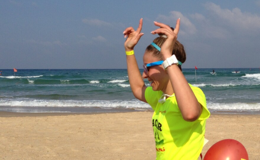 Haneen Radi finishes a 14-kilometer race in the Israeli beach town of Netanya. Because of the reaction of conservative Muslims to her running clothes, she usually runs in Jewish areas.