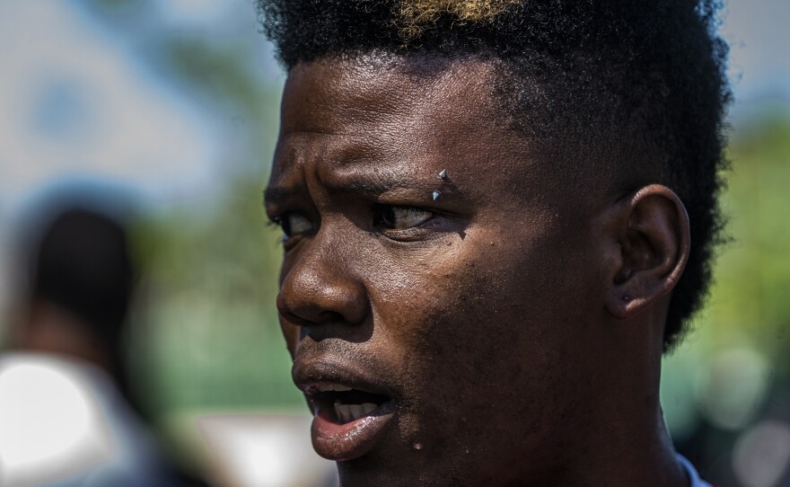 Haitian migrant Djeeff Orelien hopes to find a way to leave town on a bus provided by the INM. He is exasperated by the lack of buses and help from the Mexican government.