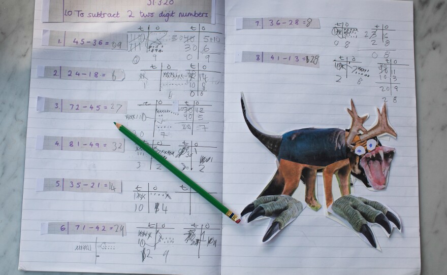 Joe created this mythical beast for an art assignment using photo collage. It sits comfortably on his homeschooling notebook next to a math assignment.