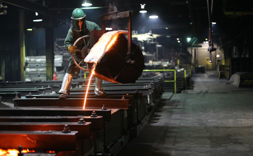 Houseman pours molten iron for the plates. The foundry creates 4,000 cast iron piano plates a year.