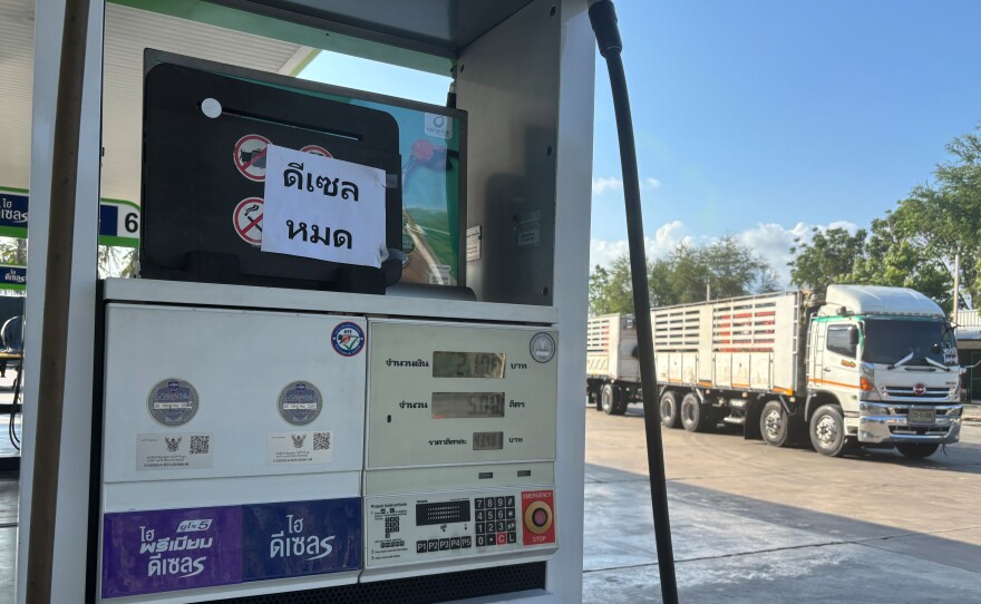 A sign announcing 'Diesel fuel has run out' is displayed on a gas station, in Prajuab Kirikhan, Thailand, Wednesday, March 18, 2026.