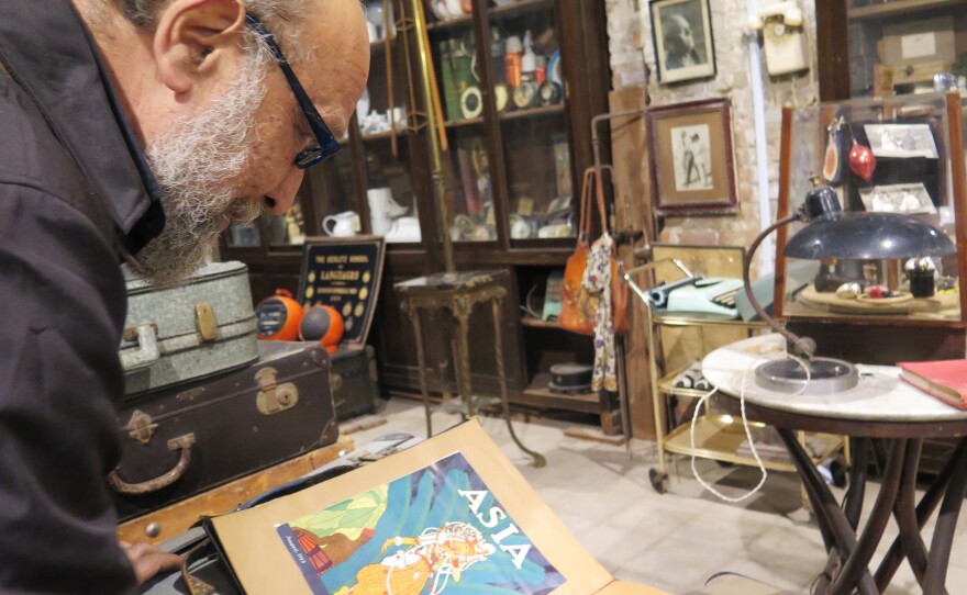 Amgad Naguib examines part of his collection of magazines from the 1930s and 1940s at the recent exhibit at Cairo's Townhouse gallery.