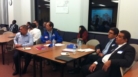Salih Habib (right), an IT specialist from Baghdad, and other newcomers met with potential employers and professional groups at the second annual International Night of Networking. 