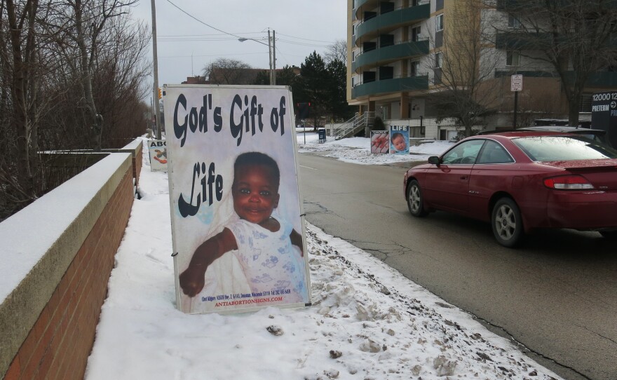 A poster put up by an abortion opponent outside Preterm clinic in Cleveland.  Preterm is seeing more women, and from farther away, since new restrictions shuttered a number of the state's other clinics that perform abortion.