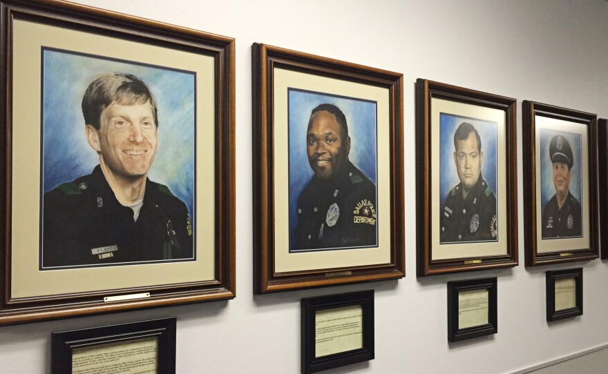 The hallway of the Dallas police academy is lined with portraits of every Dallas officer who has been killed in the line of duty.