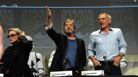 Carrie Fisher, left, Mark Hamill and Harrison Ford attend Lucasfilm's "Star Wars: The Force Awakens" panel on the second day of Comic-Con International at the San Diego Convention Center, July 10, 2015.