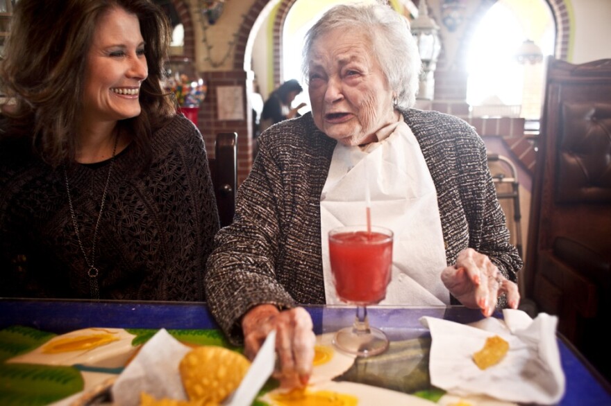 AnnaBelle Bowers, 87, has lunch with granddaughter Kelley Hawkins in Harrisburg, Pa. Kelley and her sister-in-law, LaDonna Martin, jointly care for AnnaBelle.