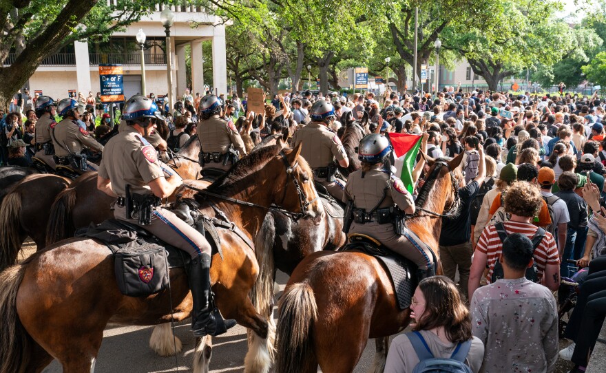 Texas State Troopers on horseback work to disperse pro-Palestinian students protesting the Israel-Hamas war on the campus of the University of Texas in Austin on Wednesday.