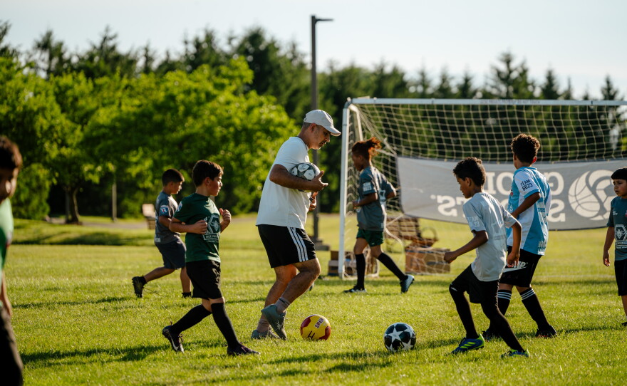 Michigan FC Director Abbas Alwishah, 44, coaches during a Michigan FC practice in Dearborn, MI. in June 2026. (Photo by Nick Hagen for NPR)