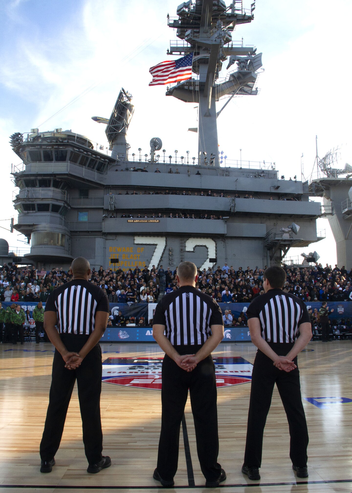 Referees before the start of the game between Michigan State University and Gonzaga University aboard the USS Abraham Lincoln on Nov. 11, 2022.