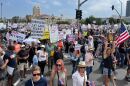 Protesters march south on Harbor Drive in downtown San Diego on June 14, 2025. The protest — which organizers are calling "No Kings" Day is part of a nationwide movement to rally against President Donald Trump's policies. 