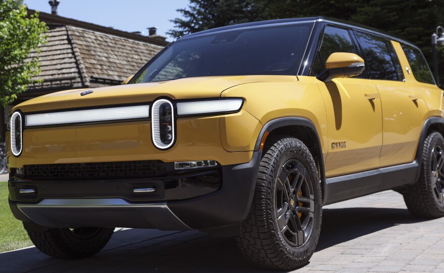 It's still unclear whether the Rivian R1S SUV, seen here, will qualify for a tax credit for electric cars after changes to the rules. Even if it does, a price cap may be a barrier for most purchasers: only a bare-bones version of the premium electric SUV squeaks under the $80,000 price cap.