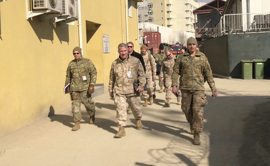 Marine Gen. Frank McKenzie, (center) is shown visiting Kabul, Afghanistan in January 2020. The Biden administration said it plans to complete a draw down of U.S. troops in the country by Sept. 11.