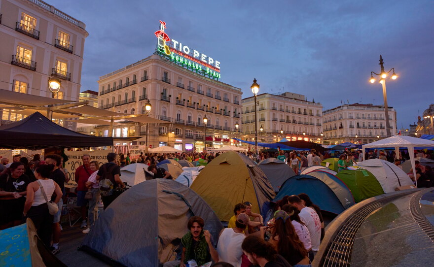 Protesters camp during a protest following the eviction last Wednesday of 87-year-old Maricarmen to demand stronger laws to protect renters at Sol square in Madrid, Spain, Sunday, Sept. 27, 2026.