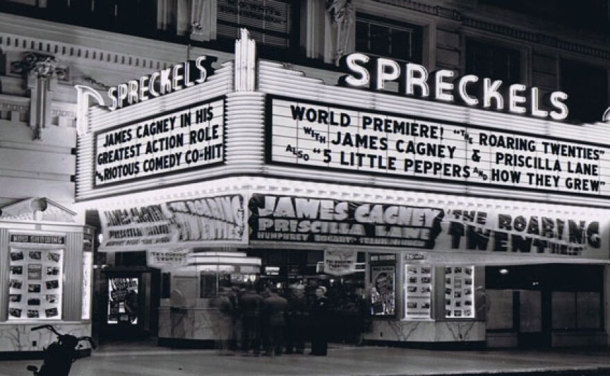 Spreckels Theatre. The theater marquee reads "World Premiere! The Roaring Twenties with James Cagney & Priscilla Lane." The Spreckels Theatre has been in almost continuous operation since its official opening on August 23, 1912. It was commissioned by sugar magnate John D. Spreckels to commemorate the opening of the Panama Canal for the 1915 Panama California Exposition.