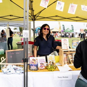 Author Tracy Badua is seen at a booth at the Filipino American Friendship Festival in this undated photo.