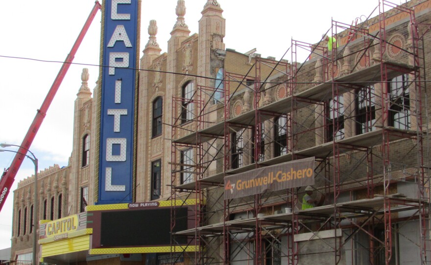 Philanthropists with ties to Flint, Mich., are fixing up the Capitol Theatre. Next door, the century-old Dryden Building has also been renovated.